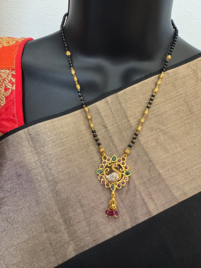 Traditional look peacock design pendant with a black bead chain