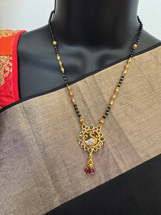 Traditional look peacock design pendant with a black bead chain