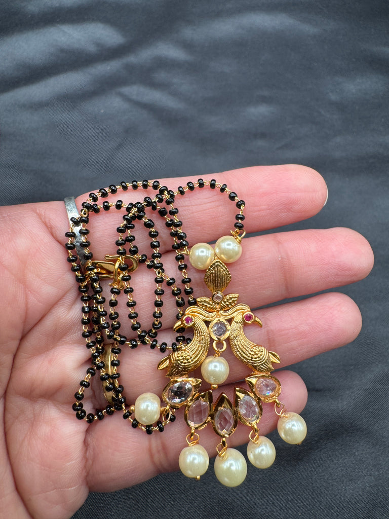 Simple antique peacock design with uncut stones and pearls black beads chain