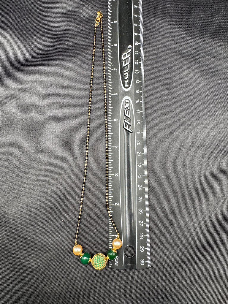 Green stone ball and Swarovski pearls with a single line of black bead chain