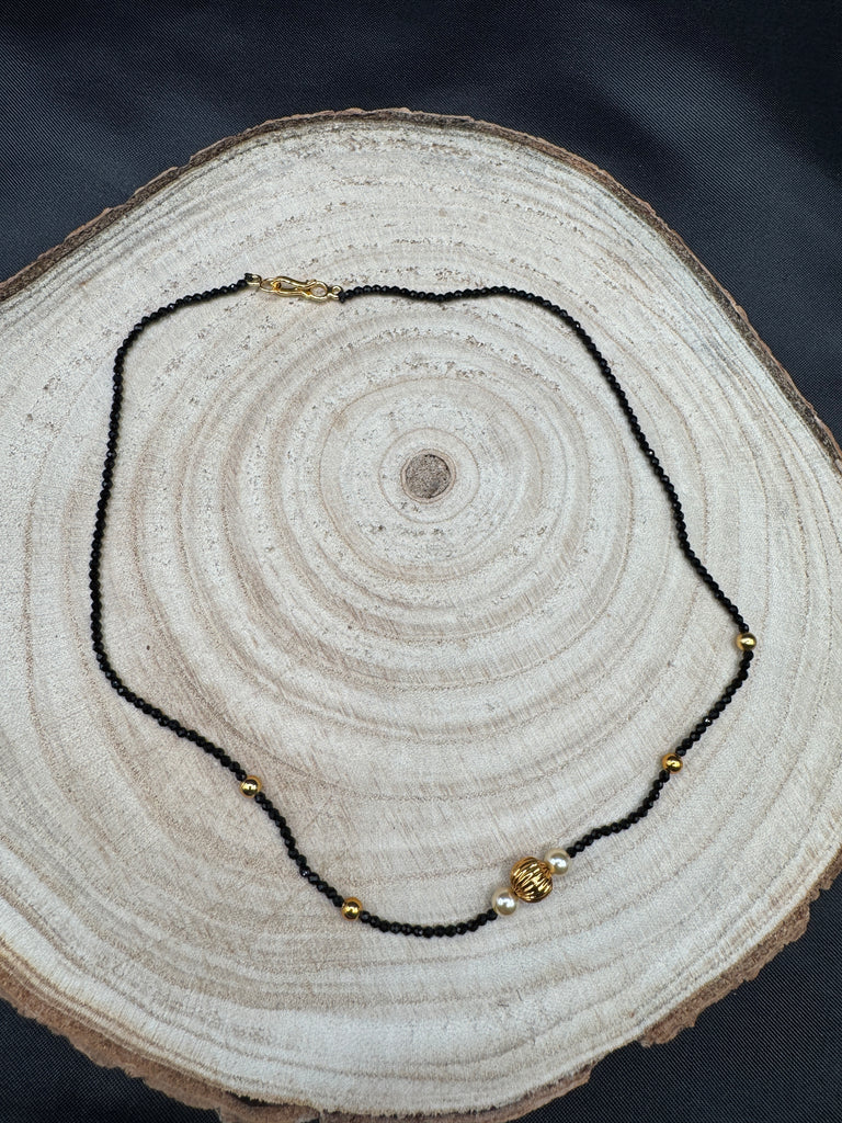 Single line black diamond bead with small gold ball and pearls