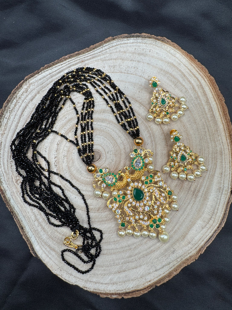 CZ stones and Emerald stones pendant with a bunch of black diamond beads necklace