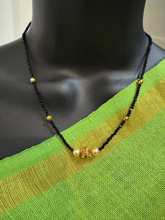 Single line black diamond bead with small gold ball and pearls