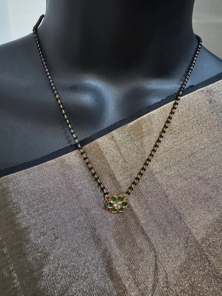 Cute Emerald pendant with a single line of black bead chain