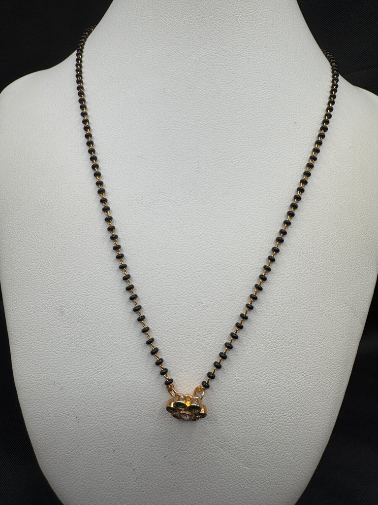 Cute Emerald pendant with a single line of black bead chain