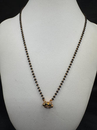 Cute Emerald pendant with a single line of black bead chain