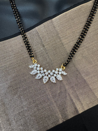 Leaf design cz stones pendant with a double line black beads chain