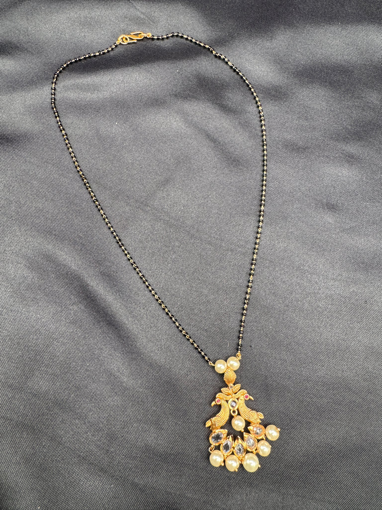Simple antique peacock design with uncut stones and pearls black beads chain