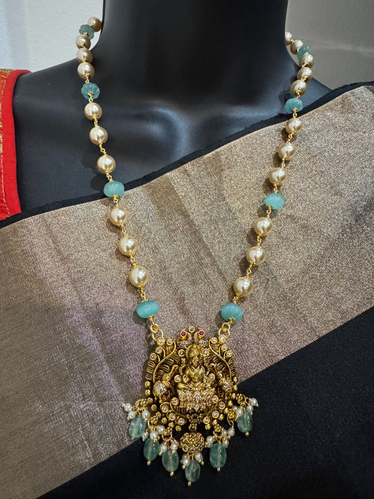 Antique Lakshmi pendant with pumpkin beads and a pearl chain
