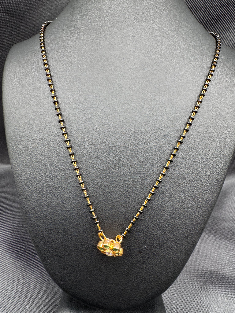 Cute Emerald pendant with a single line of black bead chain