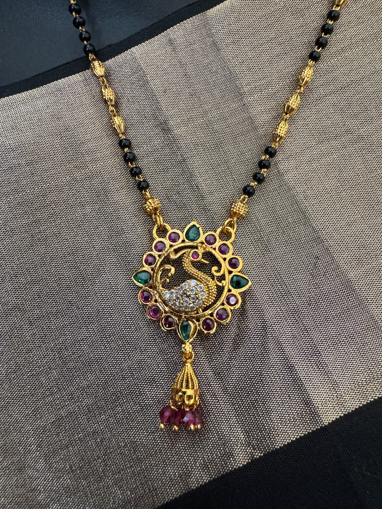 Traditional look peacock design pendant with a black bead chain
