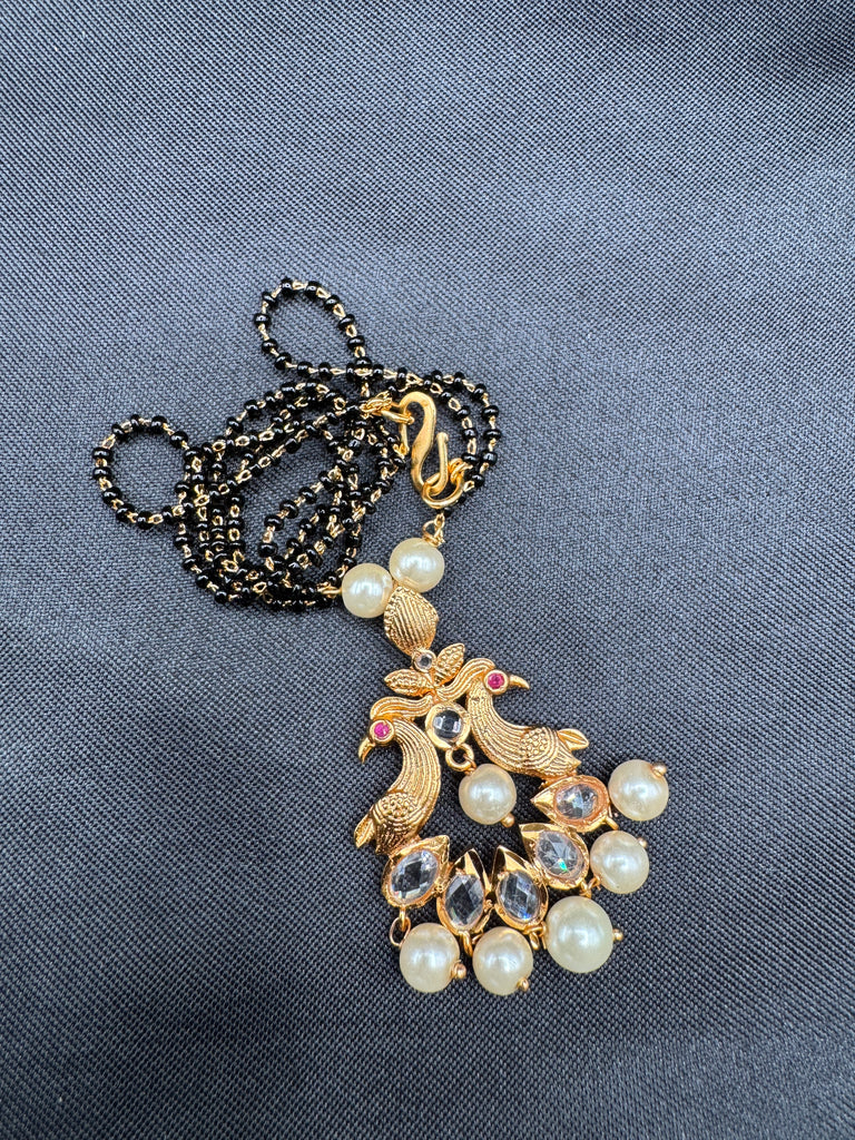 Simple antique peacock design with uncut stones and pearls black beads chain