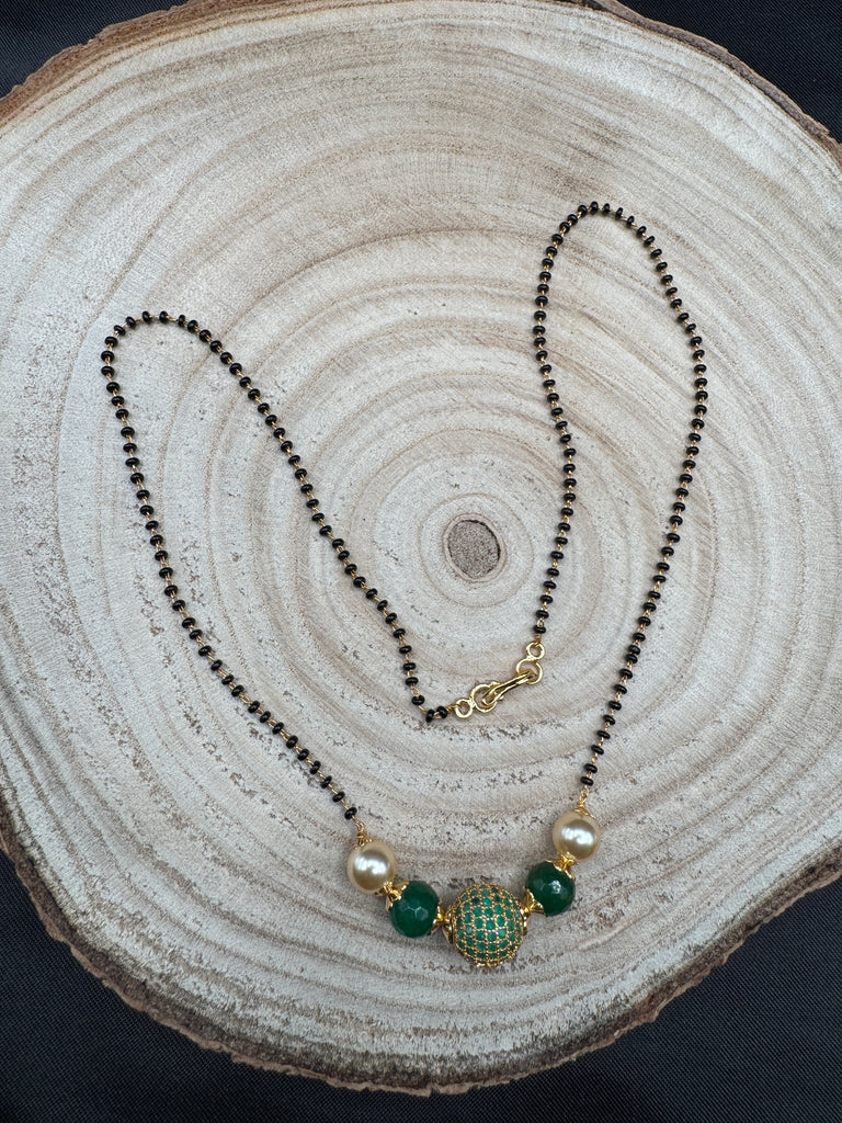 Green stone ball and Swarovski pearls with a single line of black bead chain