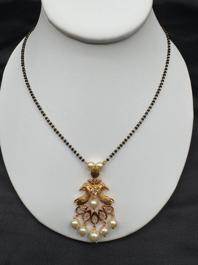 Simple antique peacock design with uncut stones and pearls black beads chain
