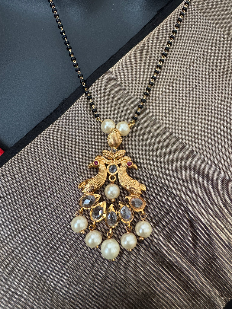 Simple antique peacock design with uncut stones and pearls black beads chain