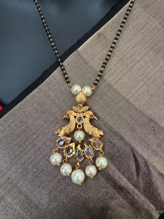 Simple antique peacock design with uncut stones and pearls black beads chain