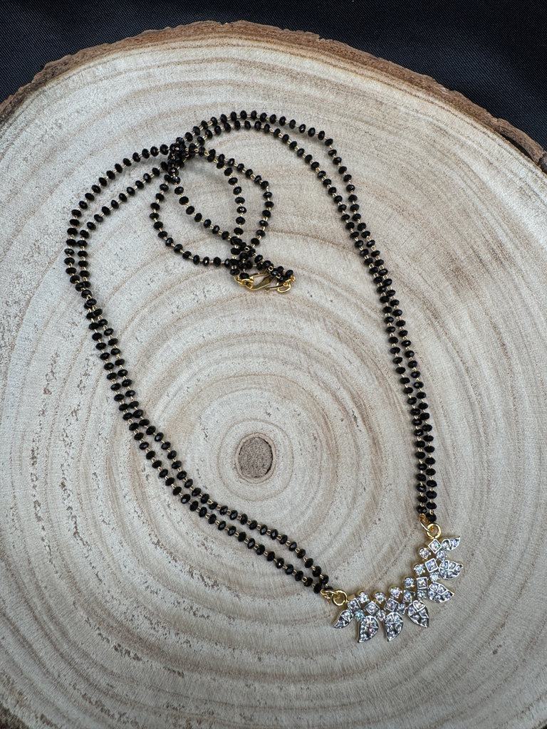 Leaf design cz stones pendant with a double line black beads chain