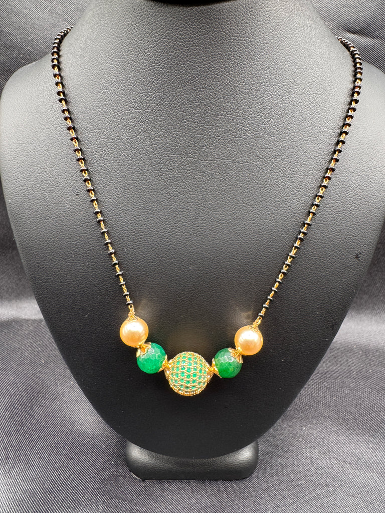 Green stone ball and Swarovski pearls with a single line of black bead chain