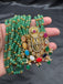 Long three-line Emerald bead chain with Navrathana Stones Venkateshwara Swamy pendant with matching earrings
