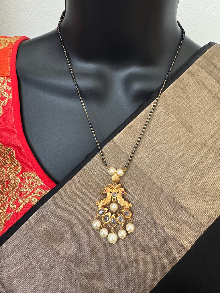 Simple antique peacock design with uncut stones and pearls black beads chain
