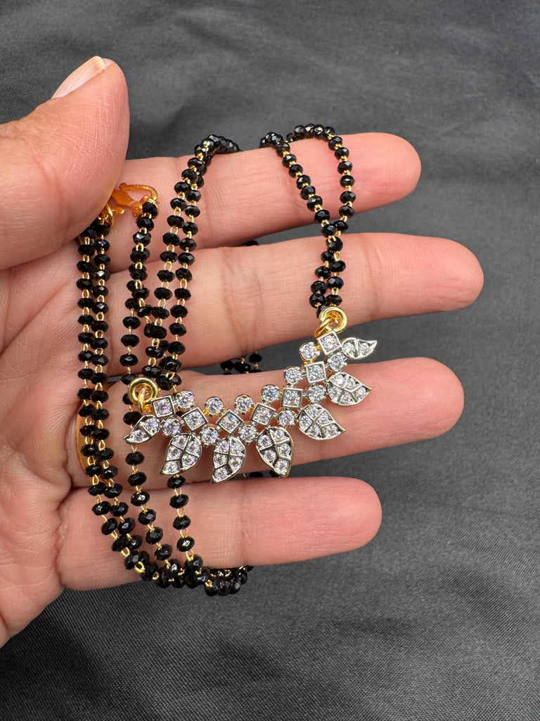 Leaf design cz stones pendant with a double line black beads chain