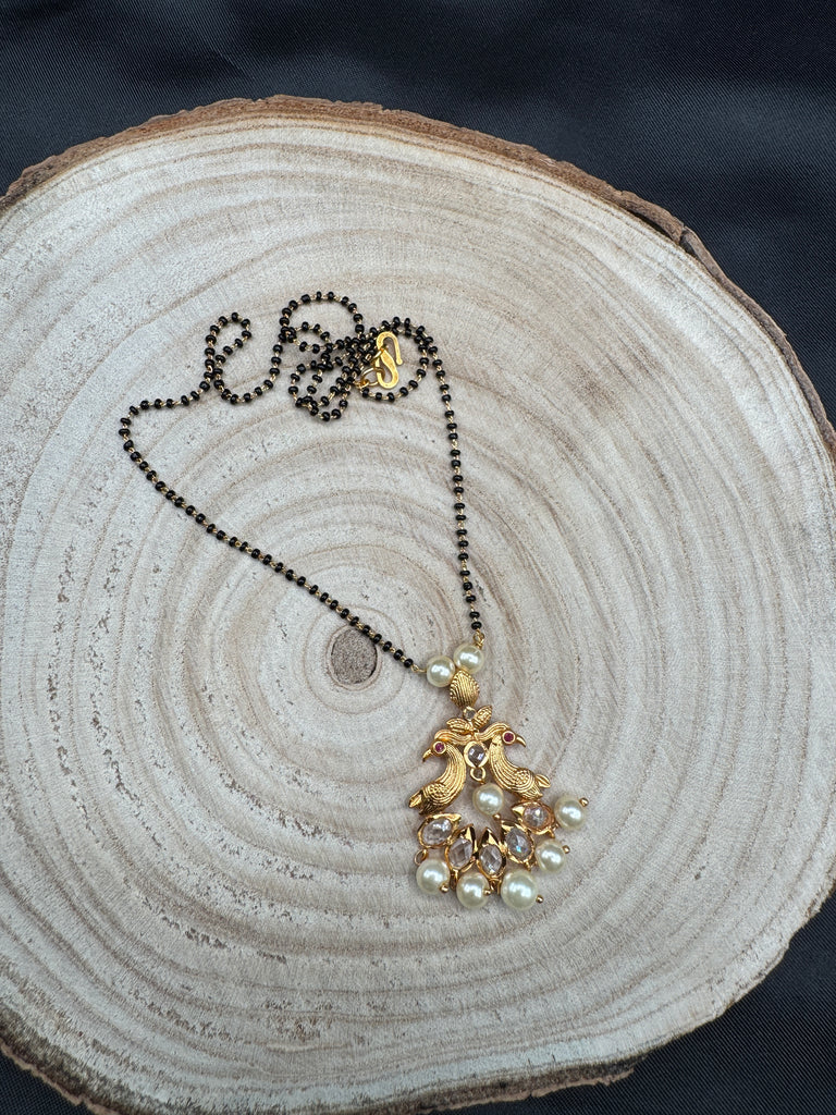 Simple antique peacock design with uncut stones and pearls black beads chain