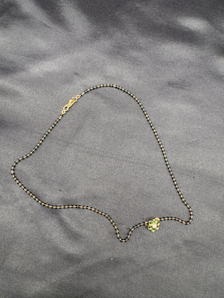 Cute Emerald pendant with a single line of black bead chain