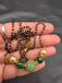 Green stone ball and Swarovski pearls with a single line of black bead chain