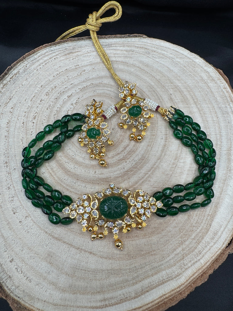 Elegant cz stones and emerald stones pendant set with a matching emerald bead chain
