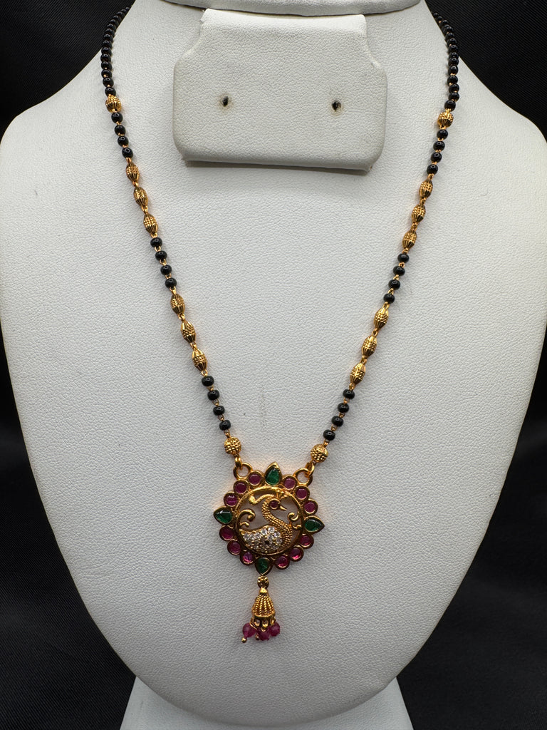 Traditional look peacock design pendant with a black bead chain