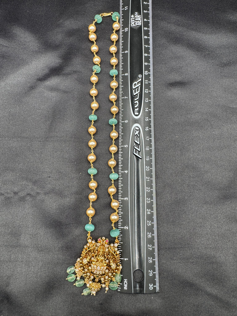 Antique Lakshmi pendant with pumpkin beads and a pearl chain