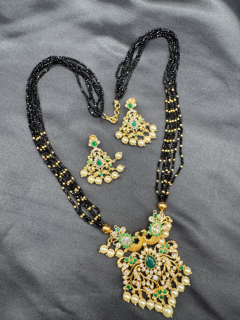 CZ stones and Emerald stones pendant with a bunch of black diamond beads necklace