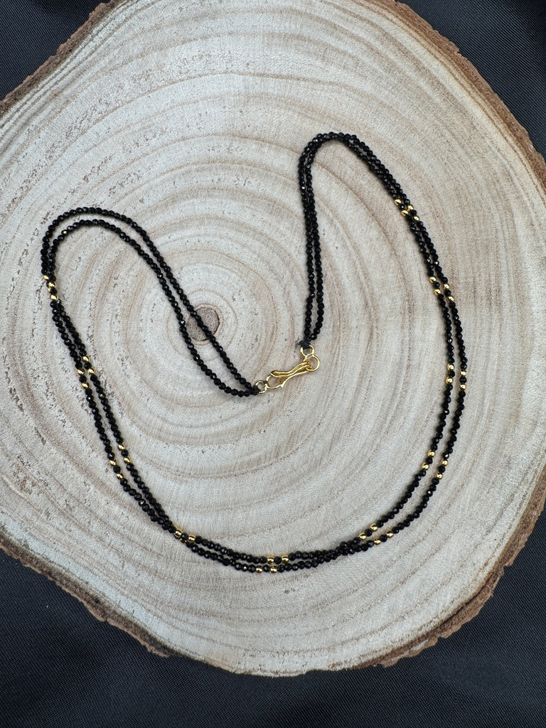 Double line black diamond beads with a gold bead chain
