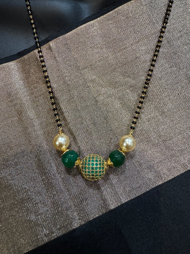 Green stone ball and Swarovski pearls with a single line of black bead chain