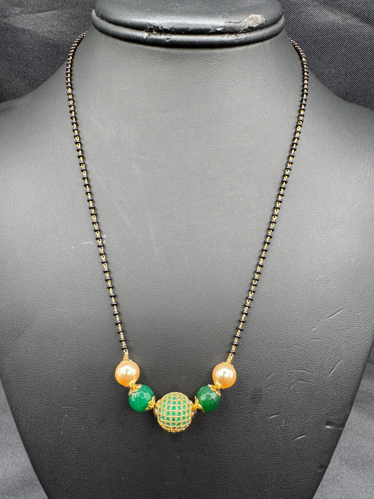 Green stone ball and Swarovski pearls with a single line of black bead chain