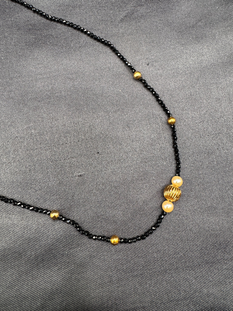 Single line black diamond bead with small gold ball and pearls