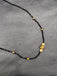 Single line black diamond bead with small gold ball and pearls