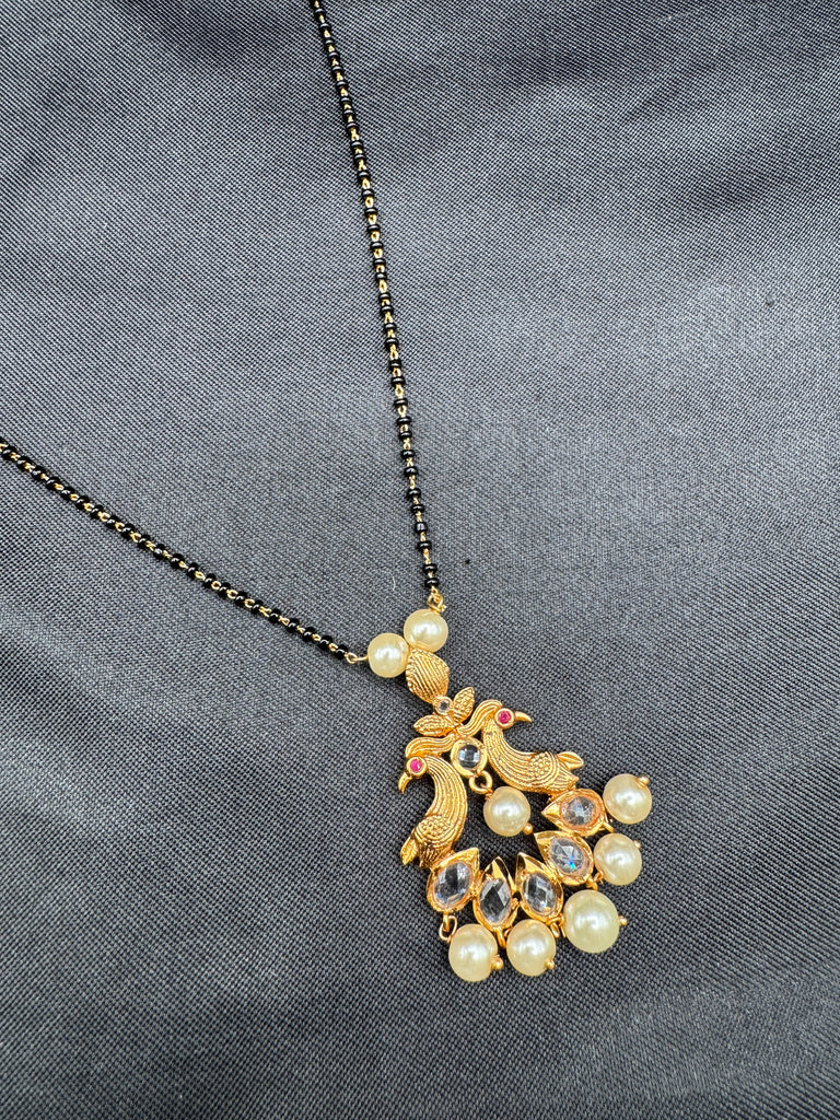 Simple antique peacock design with uncut stones and pearls black beads chain