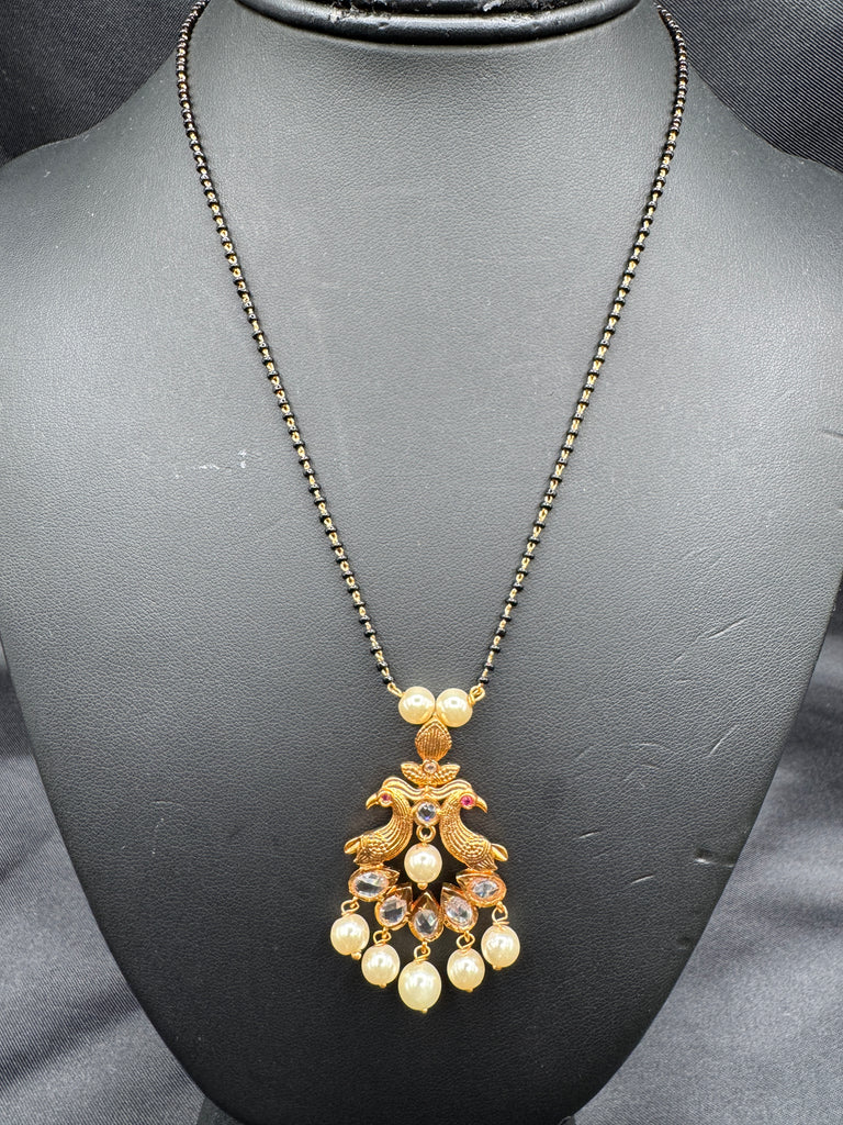 Simple antique peacock design with uncut stones and pearls black beads chain