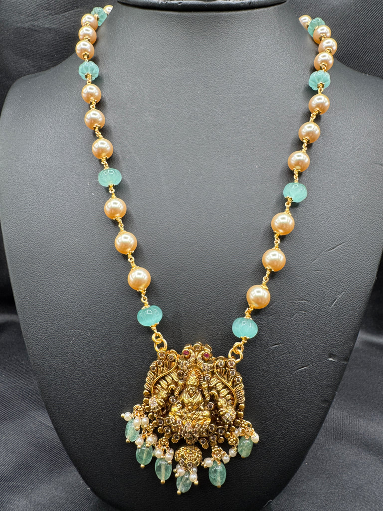 Antique Lakshmi pendant with pumpkin beads and a pearl chain