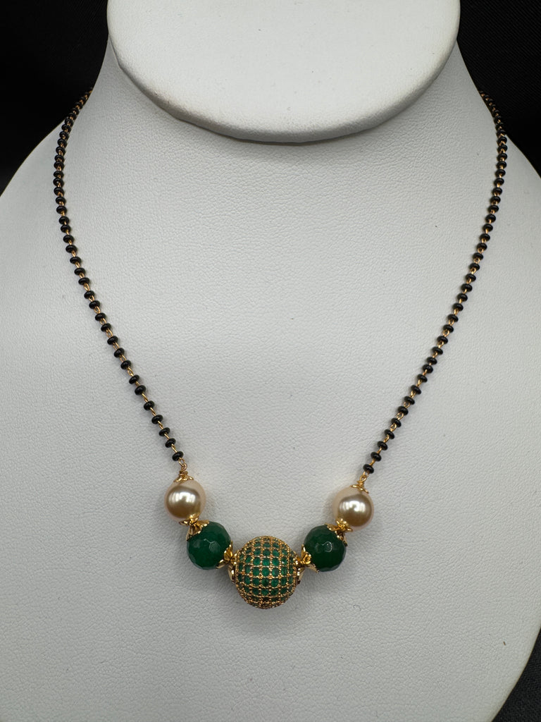Green stone ball and Swarovski pearls with a single line of black bead chain