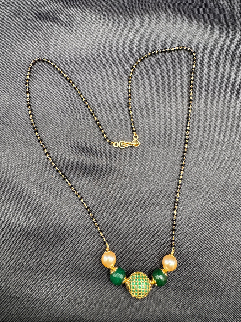 Green stone ball and Swarovski pearls with a single line of black bead chain