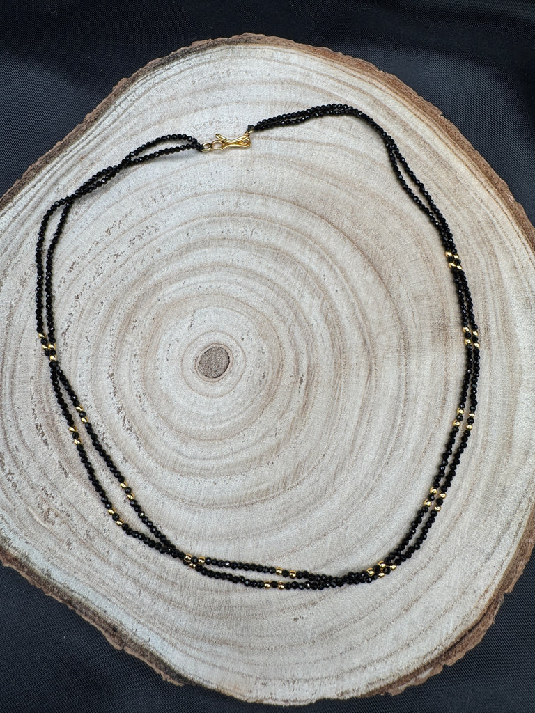 Double line black diamond beads with a gold bead chain