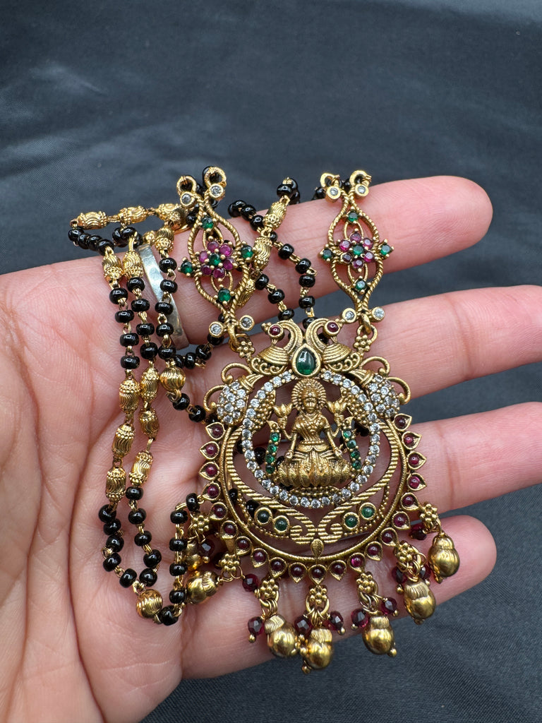 Traditional look antique Lakshmi pendant with black beads chain
