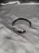 Black metal with silver wire bangle type bracelet