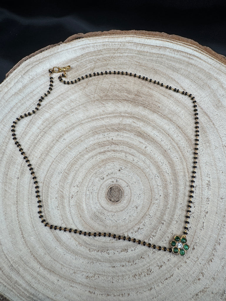 Cute Emerald pendant with a single line of black bead chain