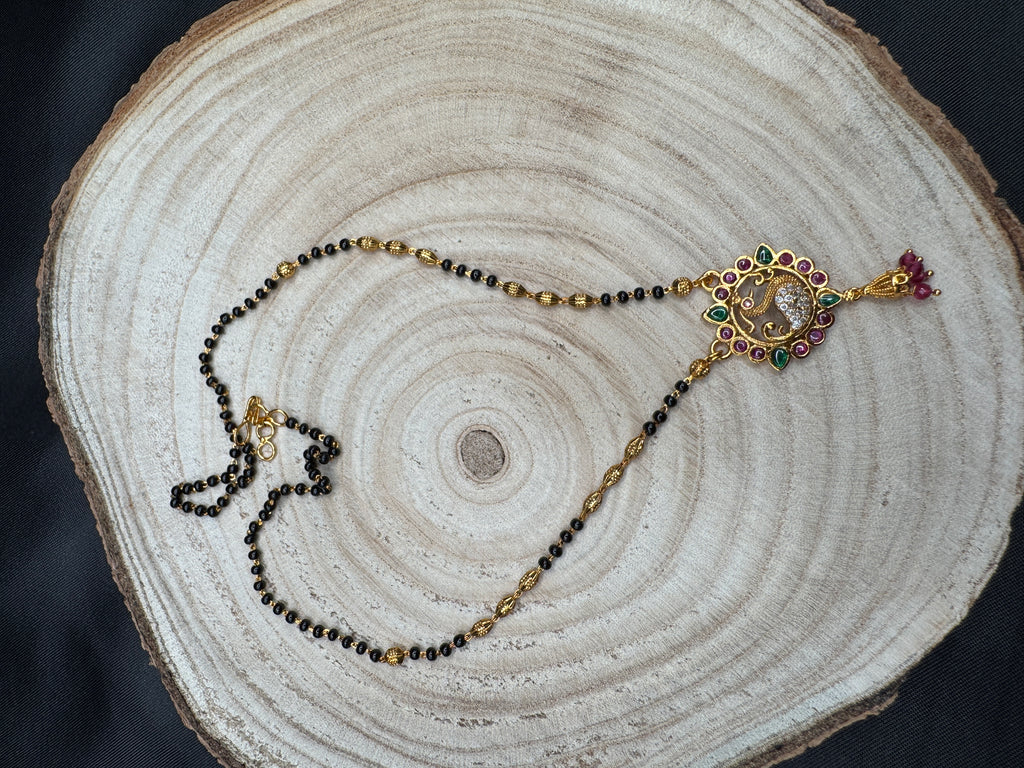 Traditional look peacock design pendant with a black bead chain
