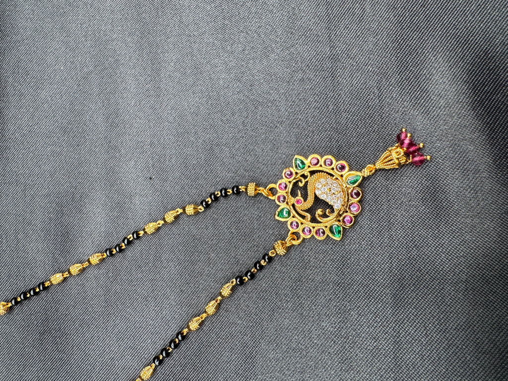 Traditional look peacock design pendant with a black bead chain