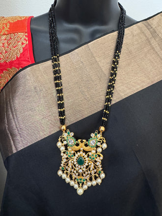 CZ stones and Emerald stones pendant with a bunch of black diamond beads necklace