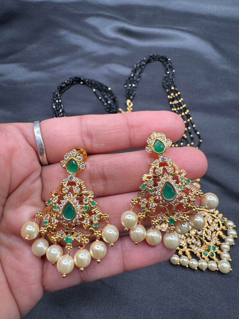 CZ stones and Emerald stones pendant with a bunch of black diamond beads necklace